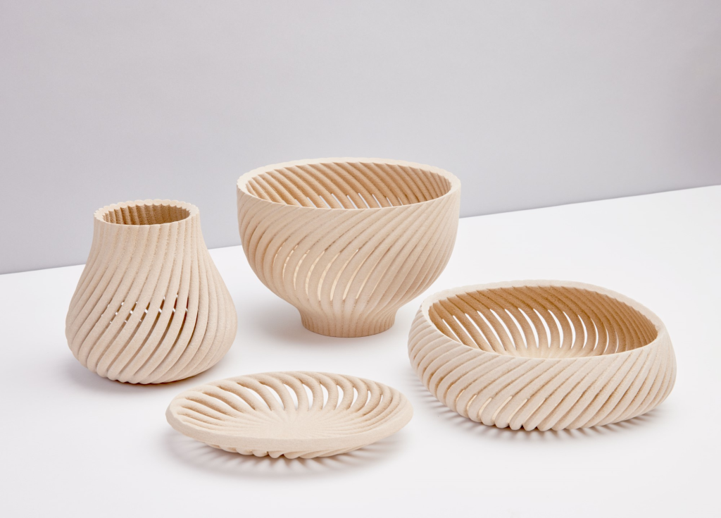 3D printed spiral vase with complex geometry and layered texture created using FDM additive manufacturing