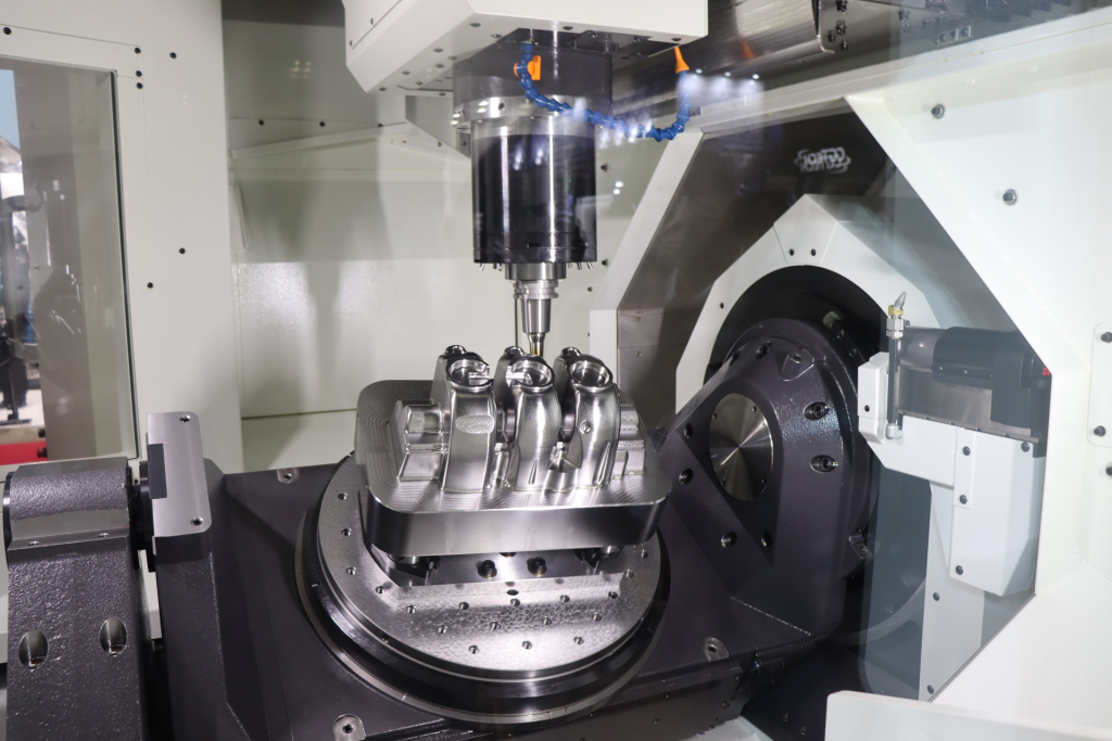 5-axis CNC machining center performing precision milling on complex metal component