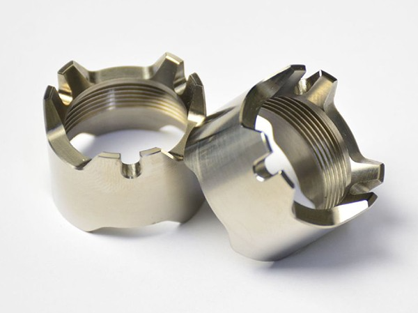 Precision CNC machined titanium aerospace components with complex threaded and structural features