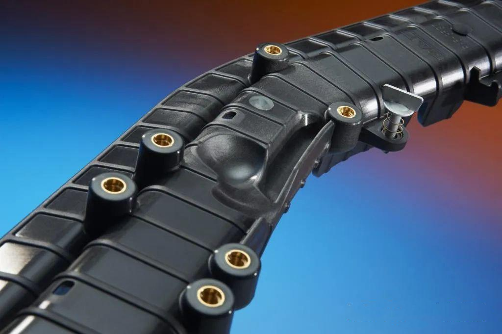 Insert molding process integrating brass metal inserts into precision plastic parts for industrial applications