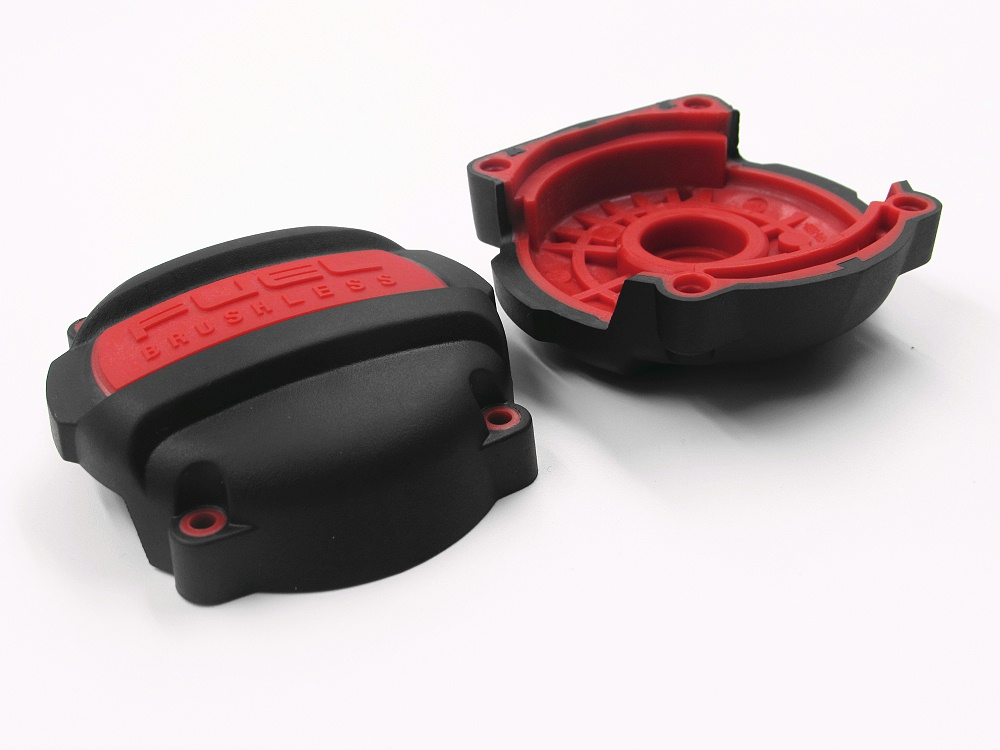 Two-shot overmolding process producing durable plastic housing for power tool applications
