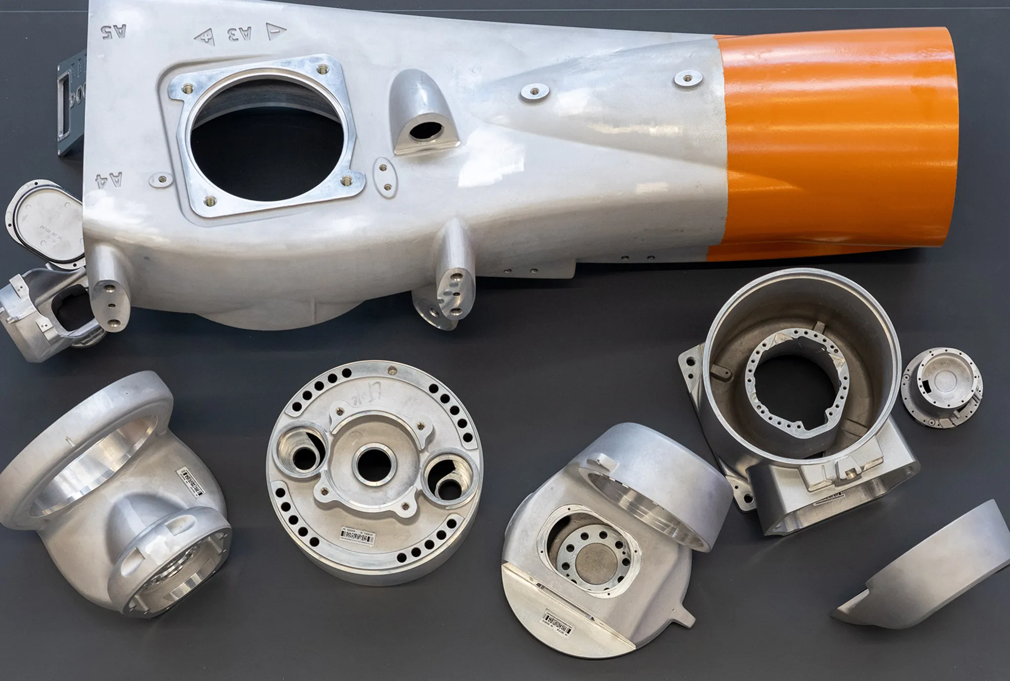 Aluminum HPDC die cast automotive steering knuckle bracket with precision CNC machined bearing bore and mounting flanges — custom structural aluminum casting for automotive and industrial OEM manufacturing