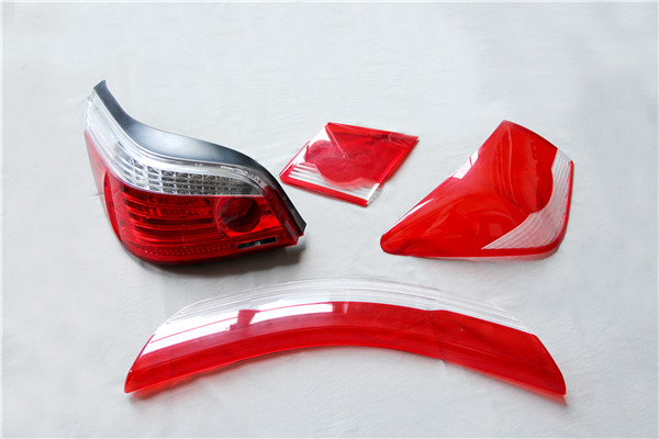Custom injection molding for automotive tail light housings and acrylic lens components with precise fitting