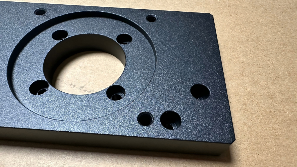CNC machined aluminum enclosure with sandblasted surface and black anodized finish for uniform texture and durability