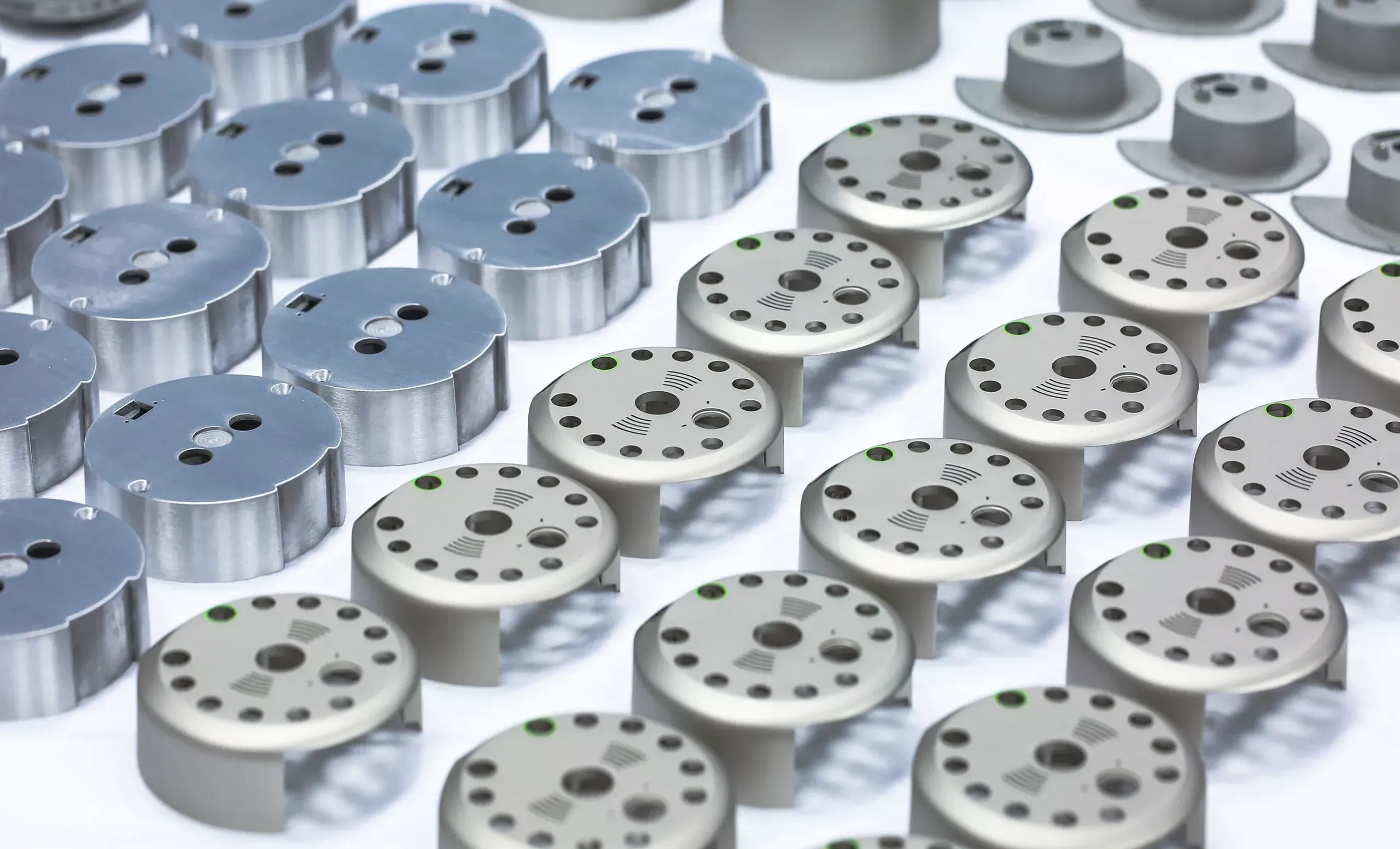 High-volume batch CNC machined aluminum 6061 precision flange disc and sensor base components with bead blasted finish and QC inspection marks — custom high-volume aluminum CNC machining for industrial and electronics OEM manufacturing