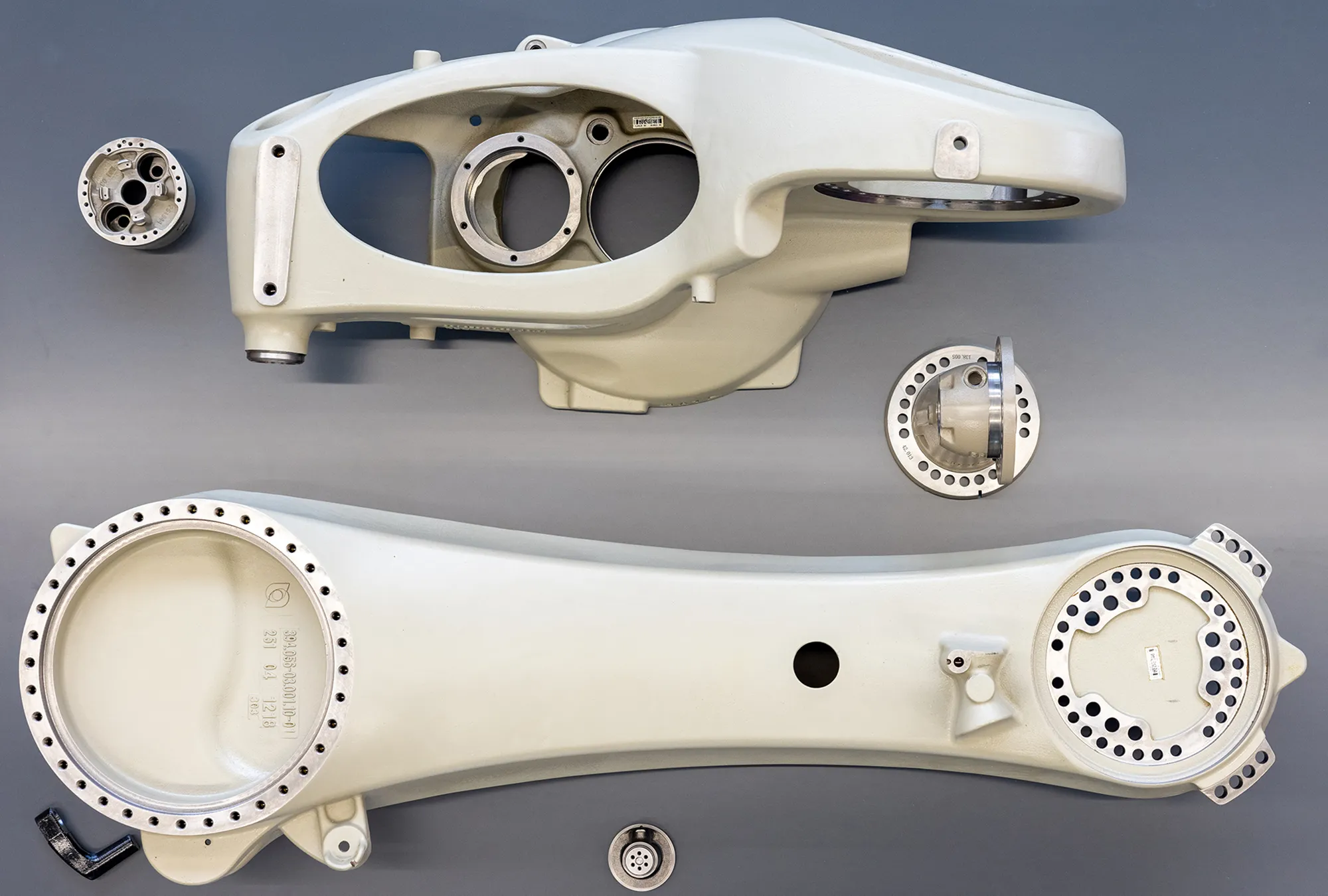 Precision CNC milled and bored cast aluminum robotic arm head housing and articulated link with flanged bolt circles — custom large-format structural component machining for industrial robot medical imaging and automation equipment manufacturing