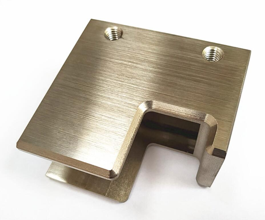 CNC machined metal component with brushed hairline finish showing uniform linear texture and premium surface quality