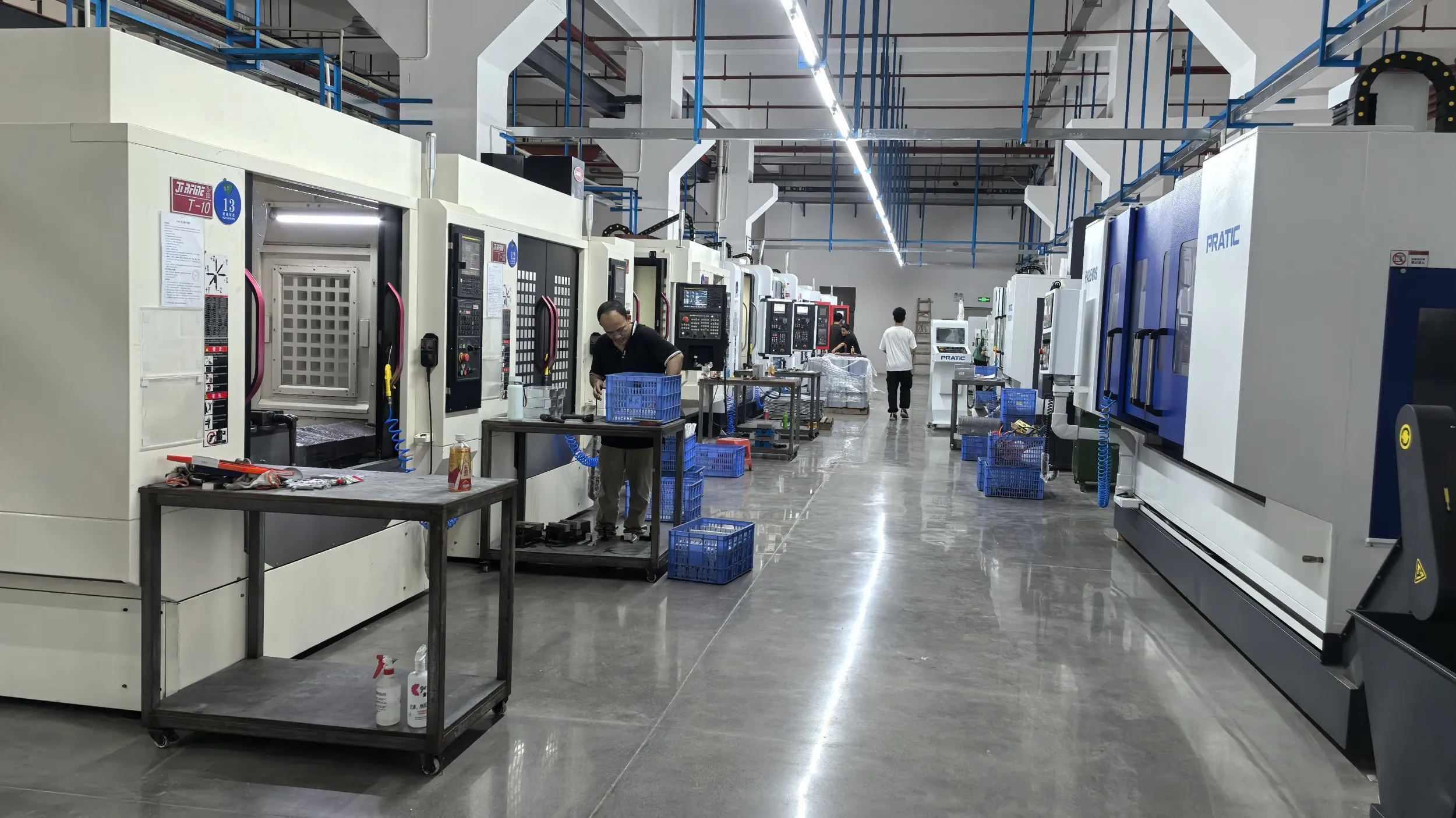 High-volume CNC machining factory workshop equipped with advanced vertical machining centers for precision custom metal parts manufacturing aerospace automotive and industrial production services