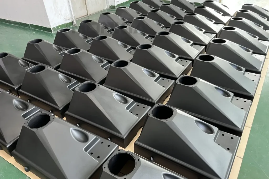 High-volume large injection molded ABS plastic housing enclosures with uniform EDM matte texture surface finish and zero sink marks — custom large-format injection mold manufacturing for industrial consumer electronics and equipment enclosure OEM production