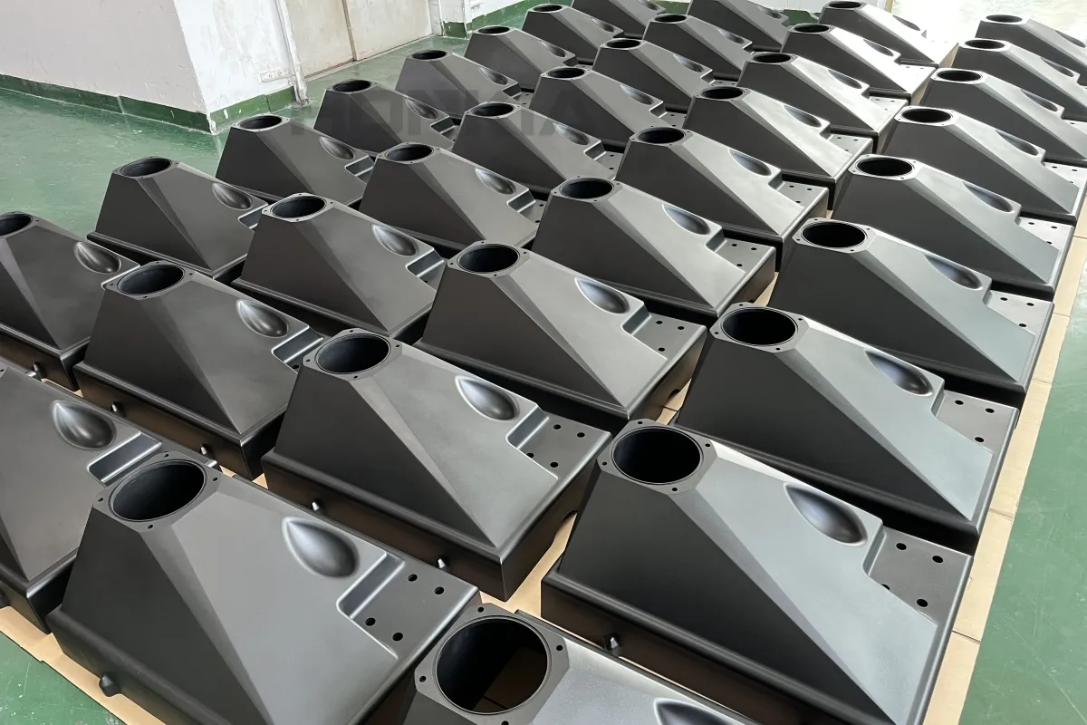 High-volume large injection molded ABS plastic housing enclosures with uniform EDM matte texture surface finish and zero sink marks — custom large-format injection mold manufacturing for industrial consumer electronics and equipment enclosure OEM production