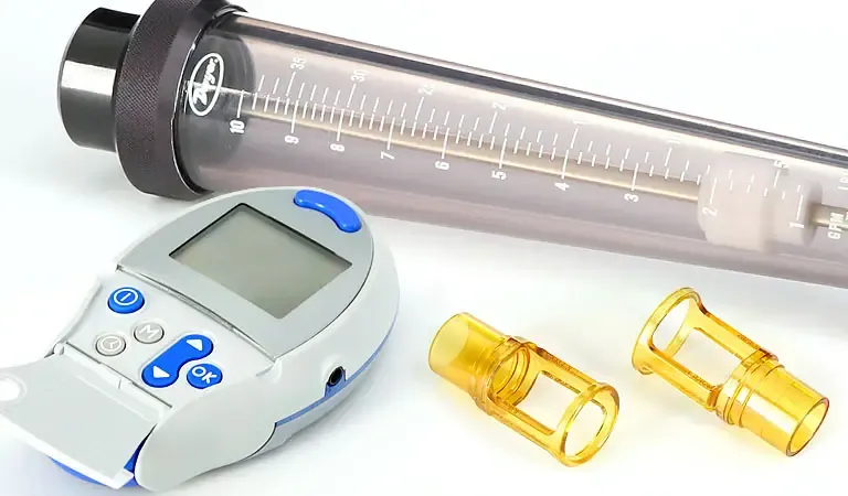 Custom injection molded medical diagnostic device components including glucometer housing transparent PC flowmeter tube and amber luer fitting connectors — precision medical grade plastic injection mold manufacturing for diagnostic equipment OEM