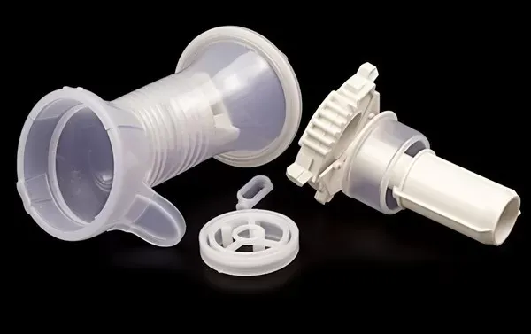 Custom precision injection molded medical nebulizer inhaler plastic housing components in PP and PC — medical grade injection mold manufacturing for respiratory device disposable parts OEM production