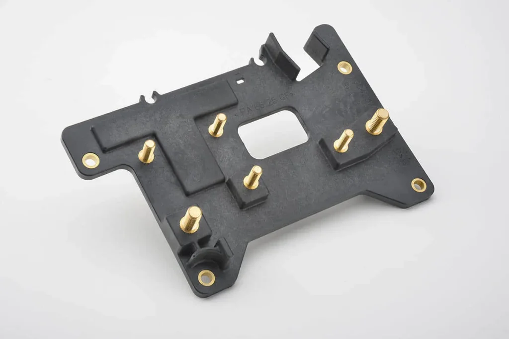 Insert molding automotive ECU multi-way pin connector with stamped nickel-plated terminal array and glass-fiber reinforced engineering plastic housing latch structure, precision insert molding parts for automotive electronic control unit board-to-wire connector manufacturing service