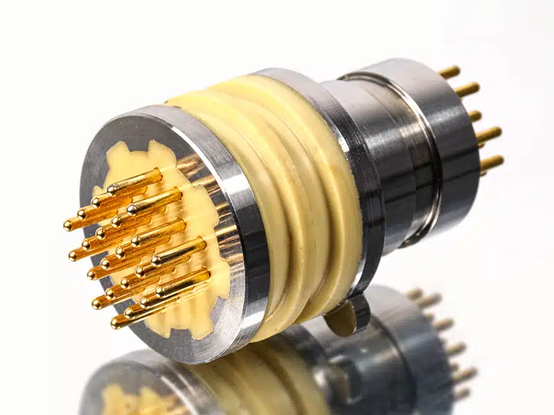Insert molding circular multi-pin connector with gold-plated brass pin array overmolded in yellow silicone insulator and stainless steel shell, precision insert molding parts for aerospace military medical sealed circular connector manufacturing service