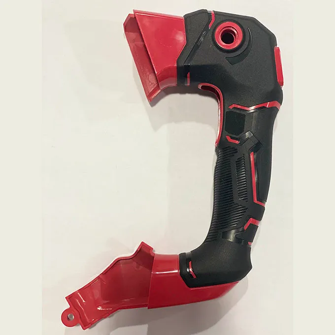 Custom overmolded power tool housing featuring rigid PC ABS structure and TPE soft-touch grip, manufactured using two-shot injection molding and precision overmold tooling for high-volume OEM production.